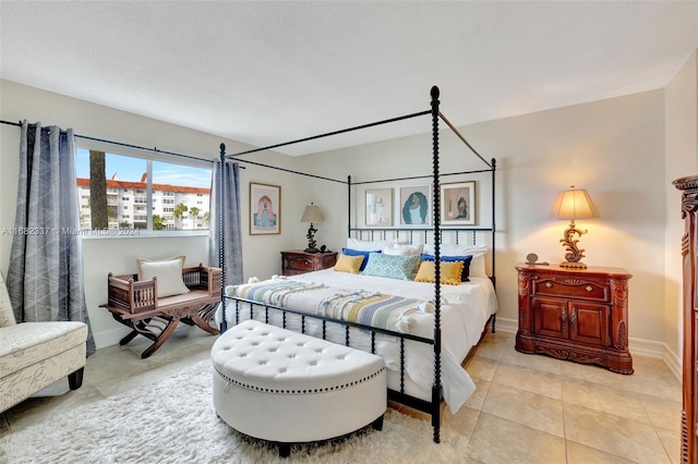 bedroom featuring light tile patterned floors