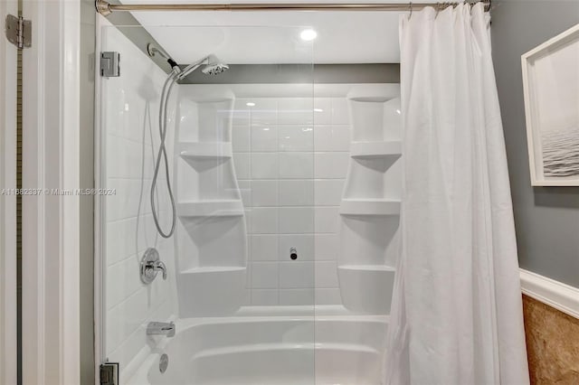 bathroom featuring shower / bath combo with shower curtain