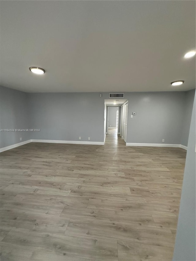 unfurnished room with light hardwood / wood-style flooring