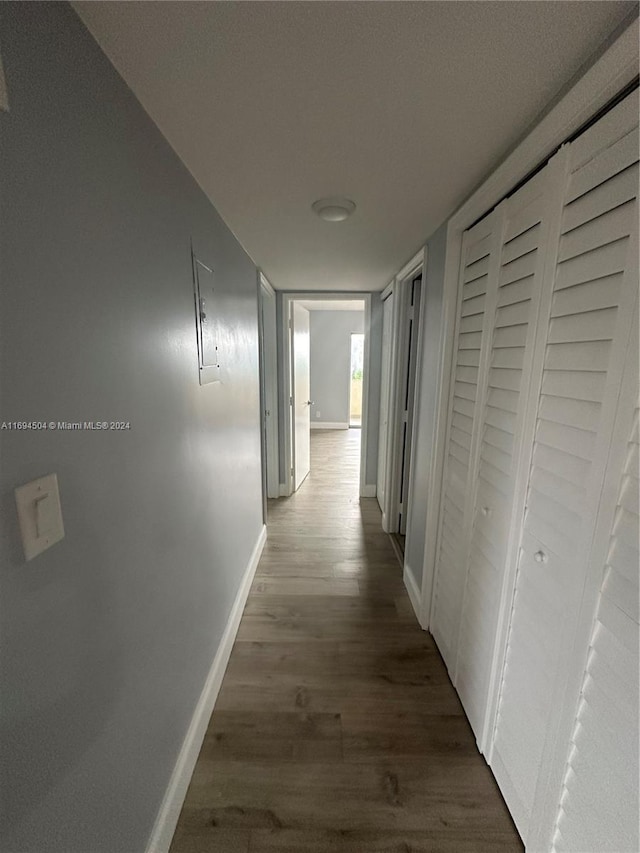 hall with dark hardwood / wood-style floors