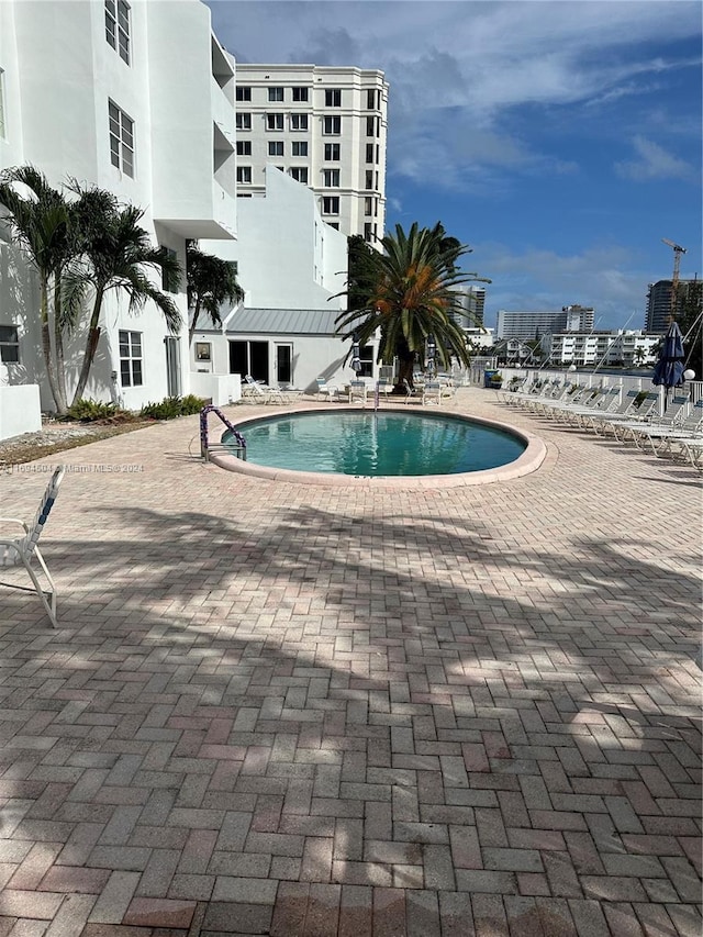 view of swimming pool with a patio area