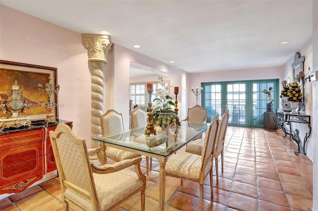 tiled dining area featuring french doors