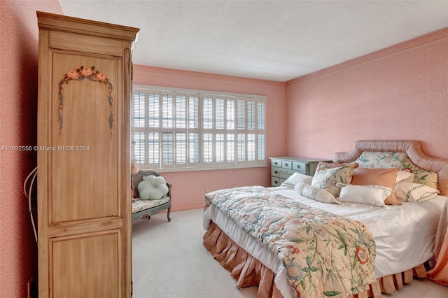 bedroom with light colored carpet