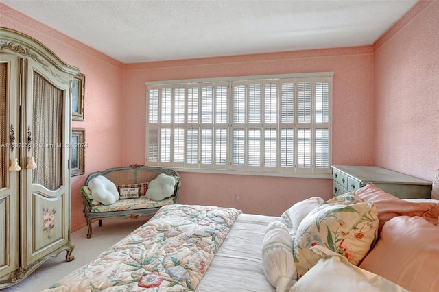 carpeted bedroom featuring ornamental molding, a textured ceiling, and multiple windows