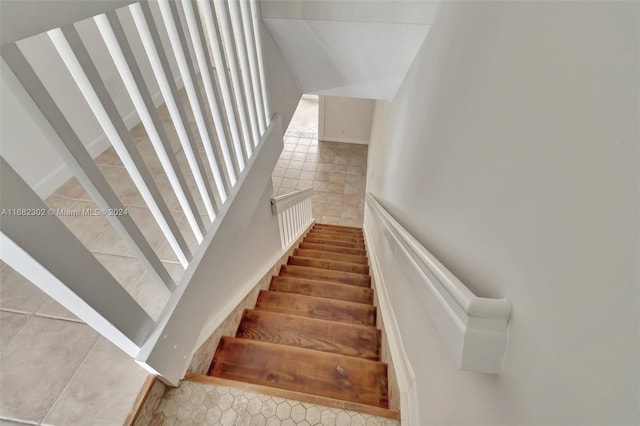 staircase with tile patterned floors