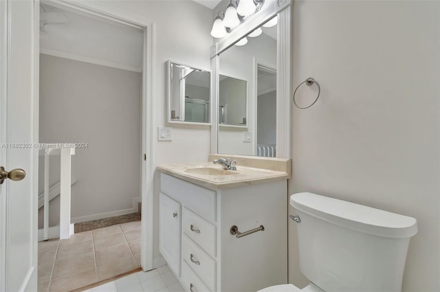 bathroom with tile patterned floors, vanity, and toilet