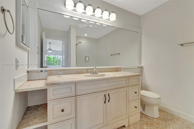 bathroom featuring ceiling fan, tile patterned flooring, vanity, and toilet