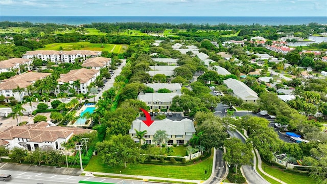 birds eye view of property featuring a water view