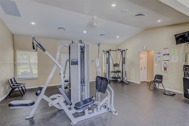 exercise room with vaulted ceiling