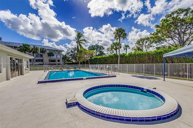 view of swimming pool with a patio