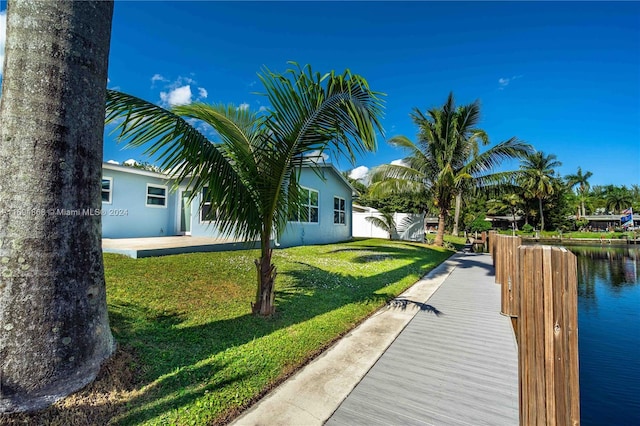 4450 SW 34th Dr, Dania Beach, FL 33312 - dock area with a lawn and a water view