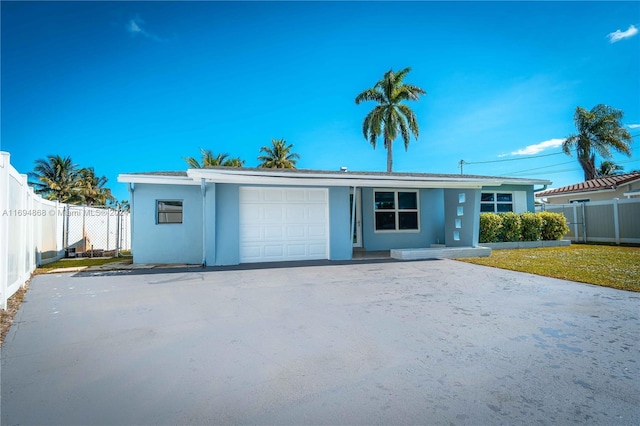 4450 SW 34th Dr, Dania Beach, FL 33312 - single story home featuring an attached garage and stucco siding