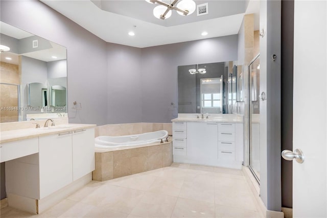 bathroom featuring tile patterned flooring, vanity, a chandelier, and shower with separate bathtub