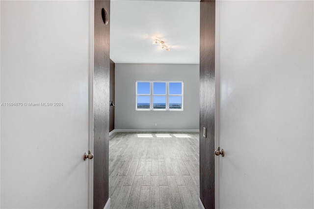 hall with light hardwood / wood-style flooring