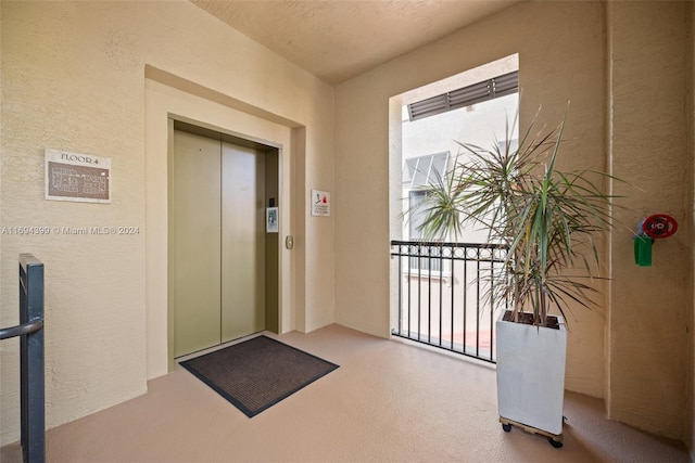 interior space featuring carpet and elevator