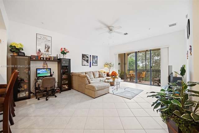 tiled living room with ceiling fan