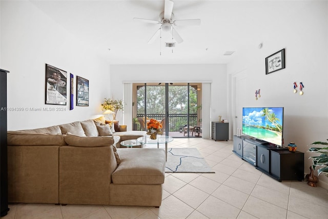 living room with ceiling fan and light tile patterned floors