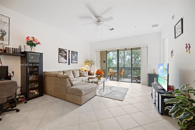 living room with ceiling fan and light tile patterned floors