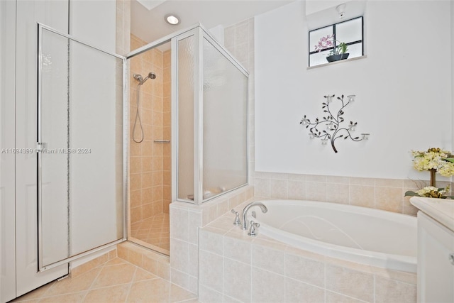 bathroom featuring tile patterned floors and independent shower and bath