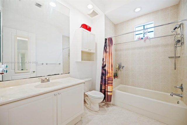 full bathroom with tile patterned floors, shower / bath combo, toilet, and vanity