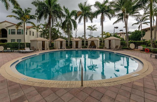 view of swimming pool featuring a gazebo and a patio area