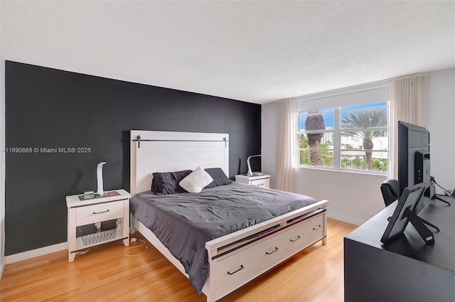 6770 Indian Creek Dr Unit 4R, Miami Beach, FL 33141 - bedroom featuring light wood-style flooring and baseboards