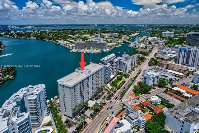 birds eye view of property with a water view