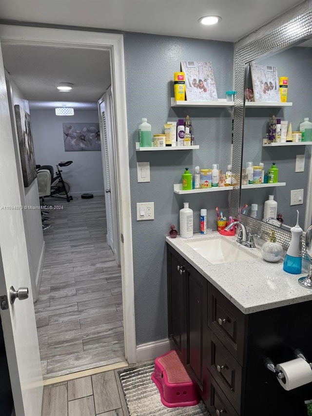 bathroom featuring wood-type flooring and vanity