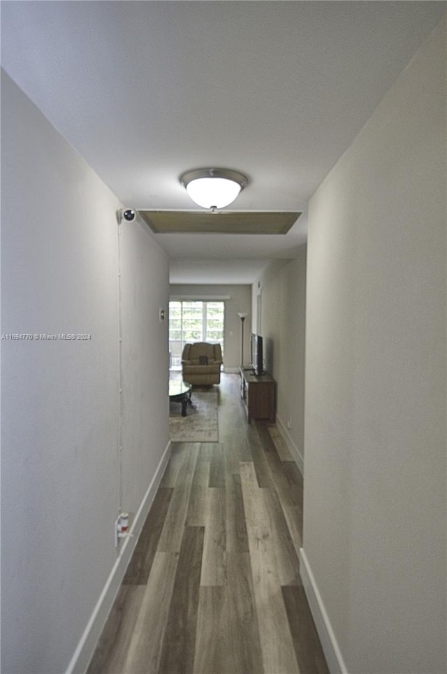 hallway featuring dark hardwood / wood-style floors