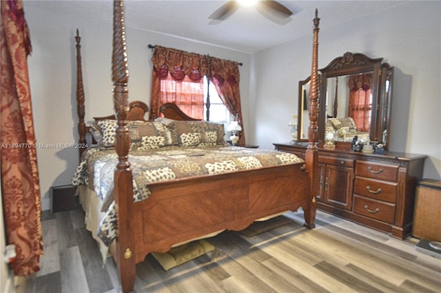 bedroom with light hardwood / wood-style floors and ceiling fan