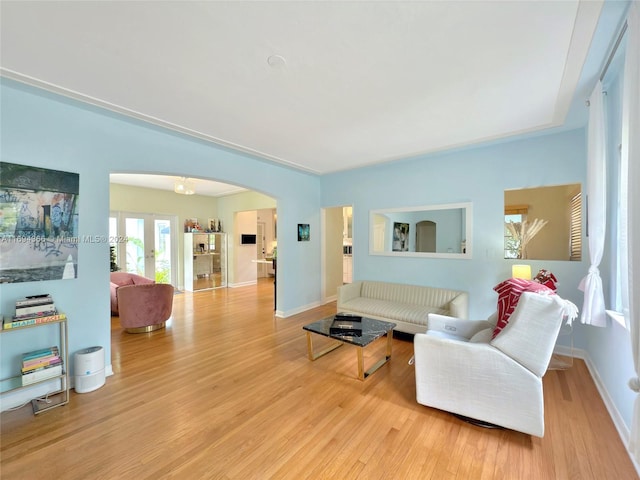 living room featuring light wood-type flooring and french doors