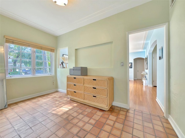 unfurnished bedroom featuring light tile patterned floors