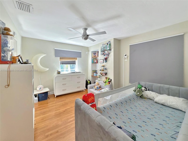 bedroom featuring light wood-type flooring and ceiling fan