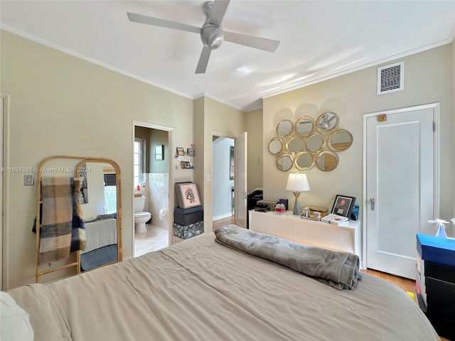 bedroom with connected bathroom, light hardwood / wood-style floors, ceiling fan, and ornamental molding