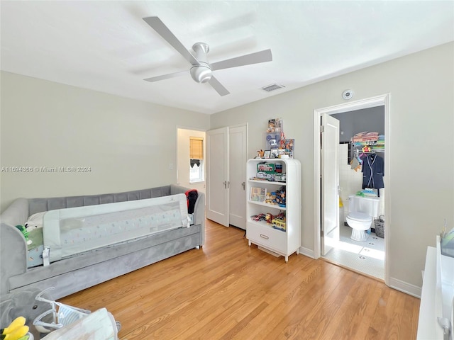 bedroom featuring light hardwood / wood-style flooring and ceiling fan