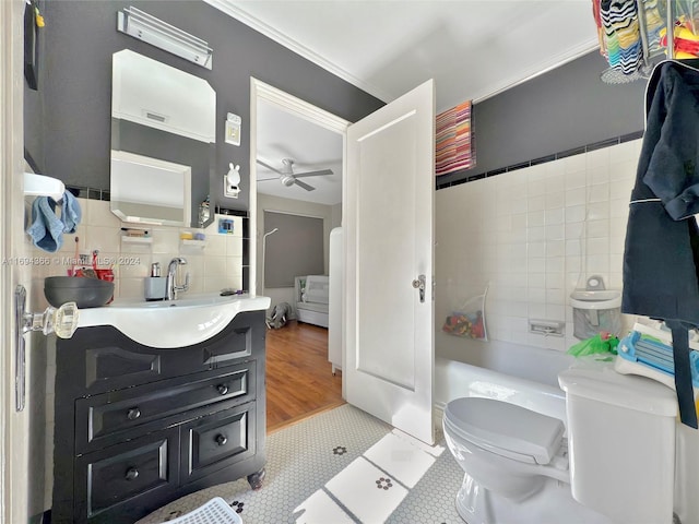 full bathroom with ceiling fan, tile patterned flooring, toilet, vanity, and ornamental molding