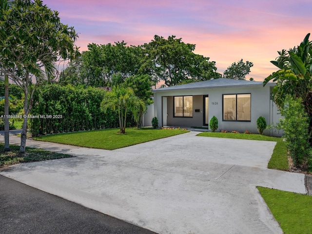 view of front of house with a yard