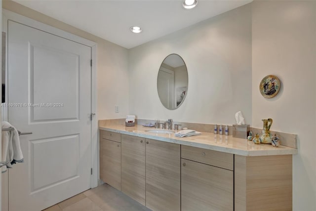 bathroom with tile patterned flooring and vanity