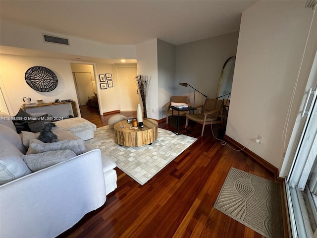 living room featuring dark hardwood / wood-style flooring