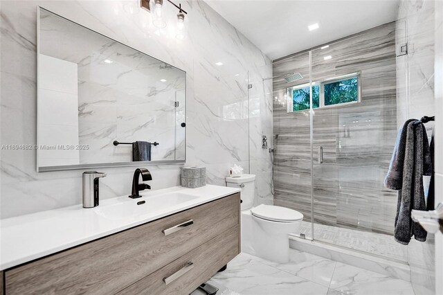 bathroom featuring vanity, tile walls, an enclosed shower, and toilet