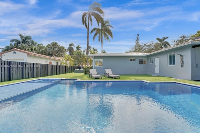 view of pool featuring a yard