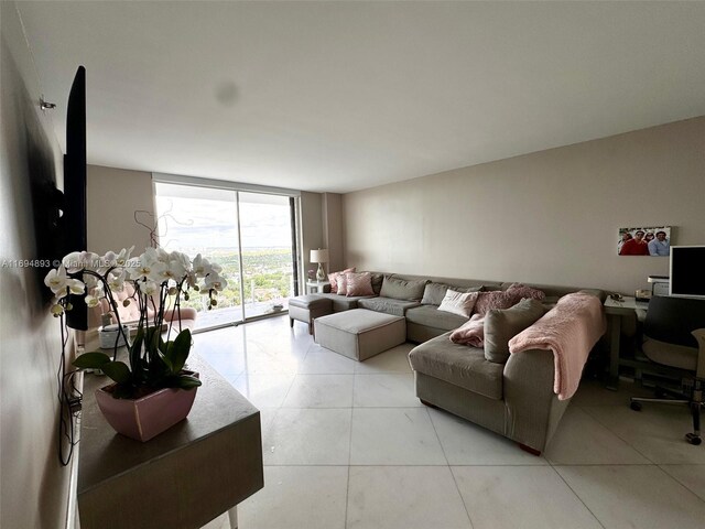 living room with floor to ceiling windows