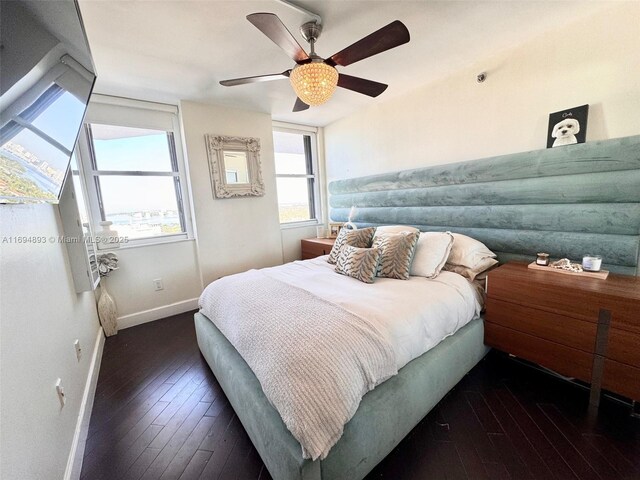 bedroom featuring ceiling fan and dark hardwood / wood-style flooring