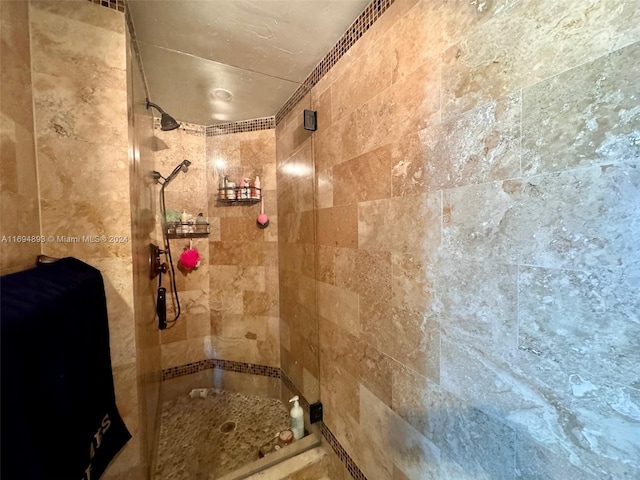 bathroom with a tile shower