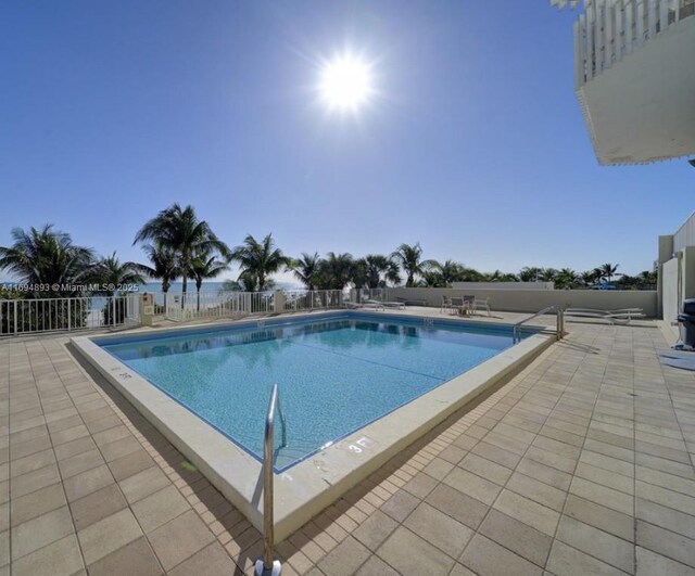 view of swimming pool with a patio