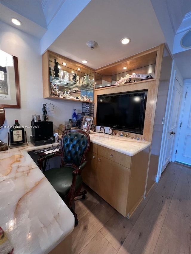 bar featuring light hardwood / wood-style flooring