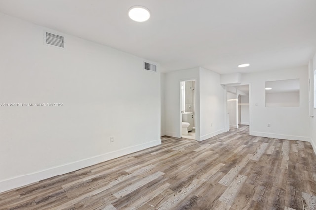 unfurnished living room with light hardwood / wood-style floors