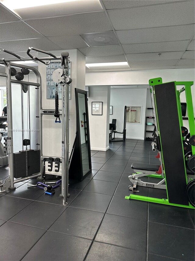 gym featuring a drop ceiling