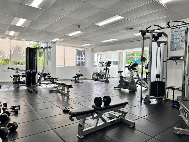 workout area featuring a drop ceiling