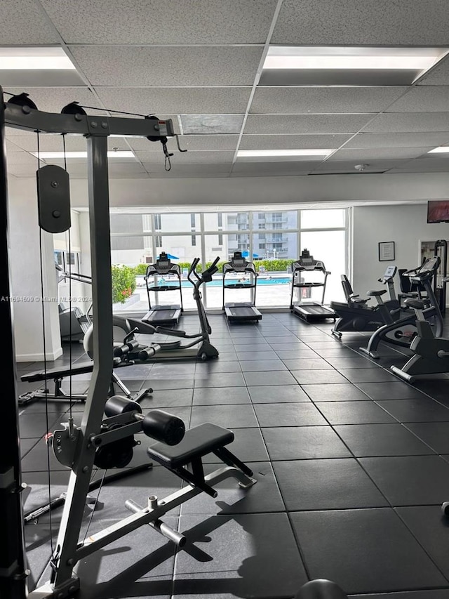 workout area with a drop ceiling